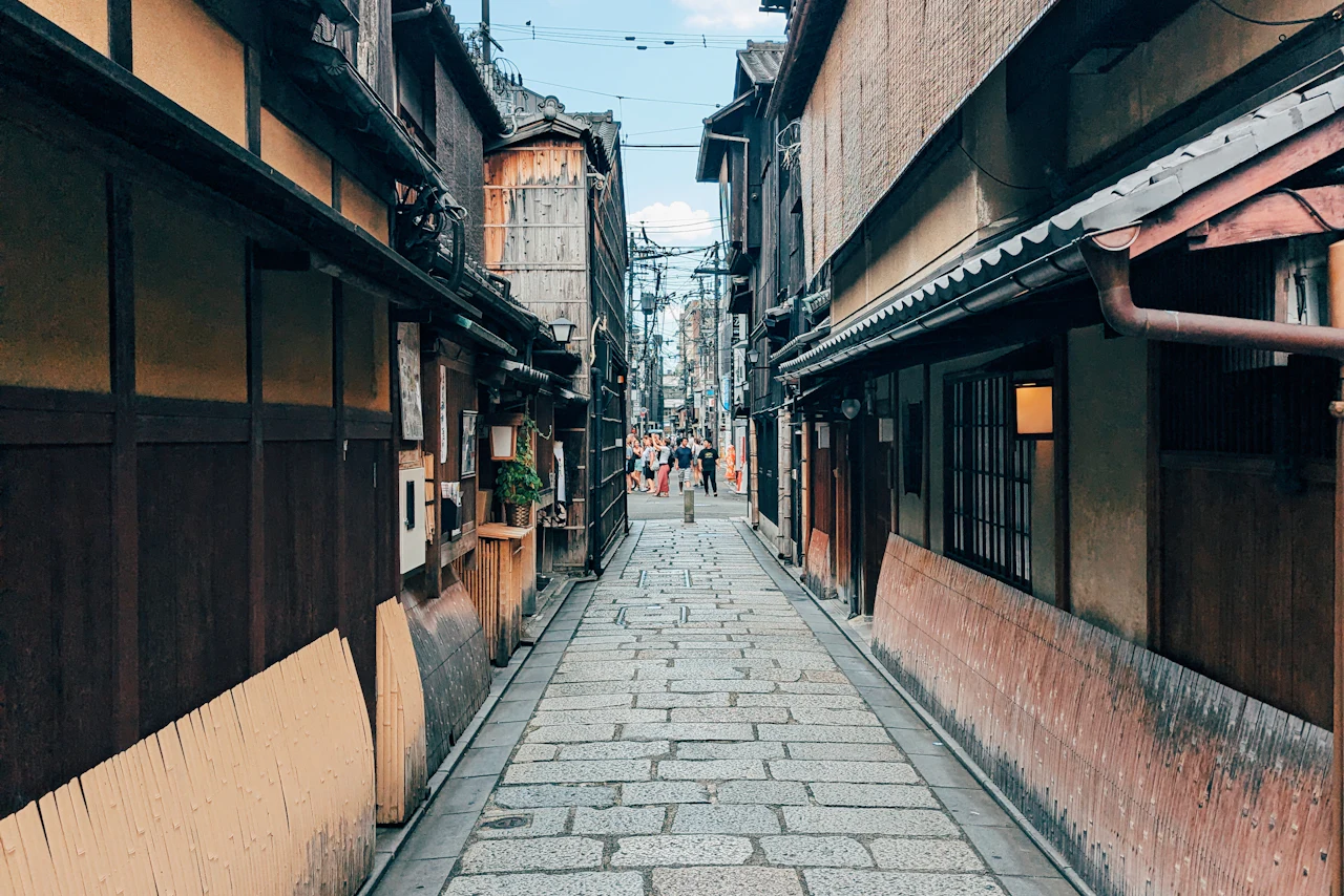 Traditional wooden buildings along a narrow Japanese street